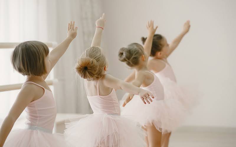 Young ballet students practicing in a studio.