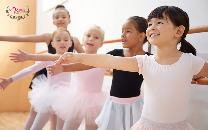 Young children learning ballet at a dance class.